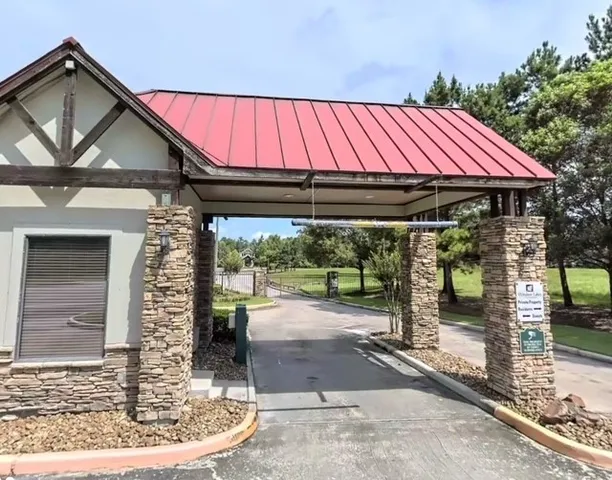 a backyard of a house with barbeque oven table and chairs