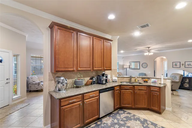 a kitchen with a sink stove and cabinets