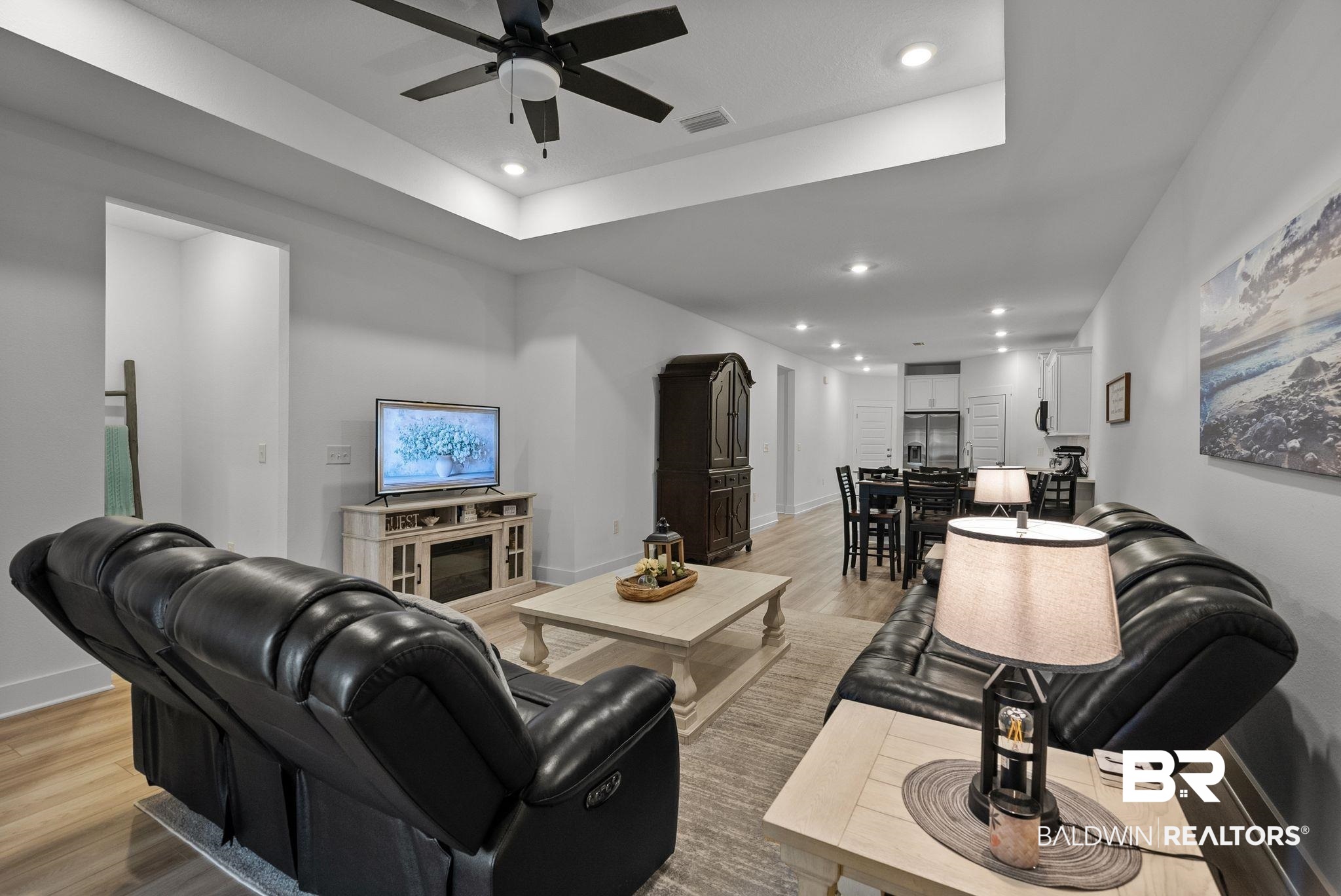 9899 Willet Way Foley, AL 36535 - Photo 7 of 37 Open-concept living area featuring wood-finish flooring, recessed lighting, and a tray ceiling with a ceiling fan