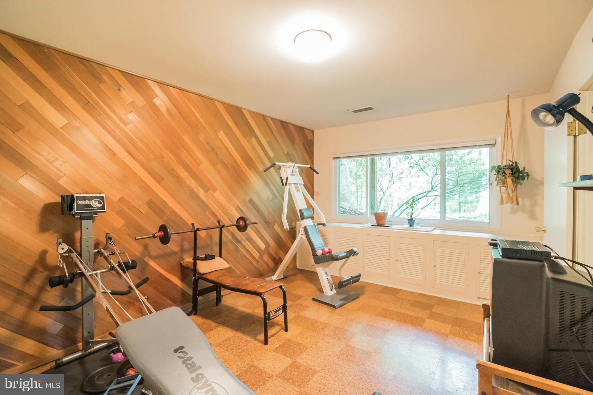 10217 Lloyd Road Potomac, MD 20854 - Photo 21 of 28 Exercise Room or Den with Accent Wall