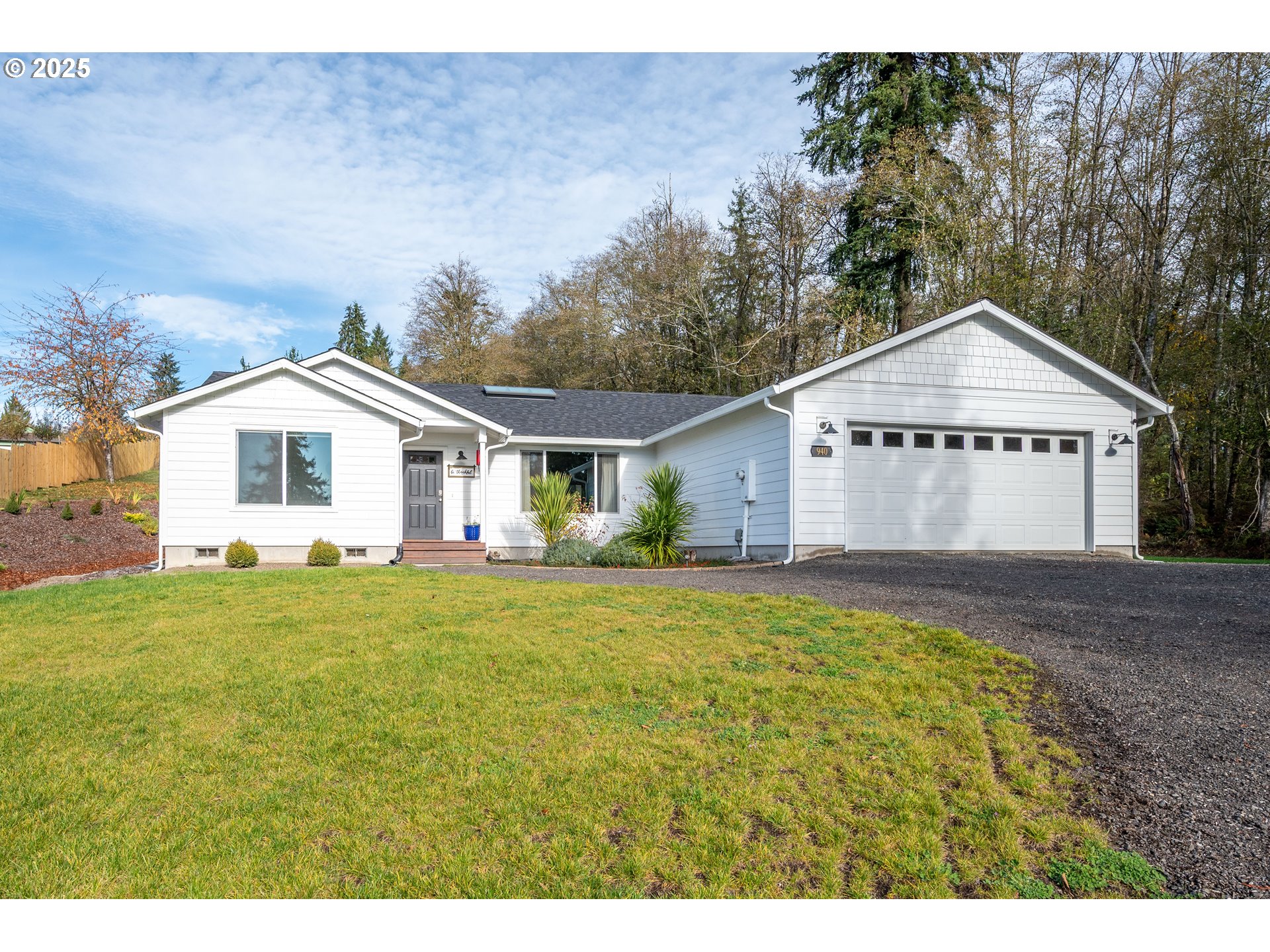 940 Stella Road Longview, WA 98632 - Photo 1 of 39 a front view of a house with a yard