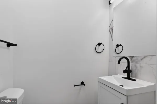 a bathroom with a sink and mirror