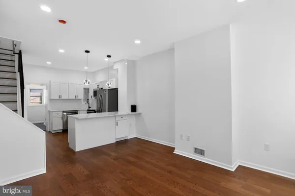 a view of kitchen with wooden floor