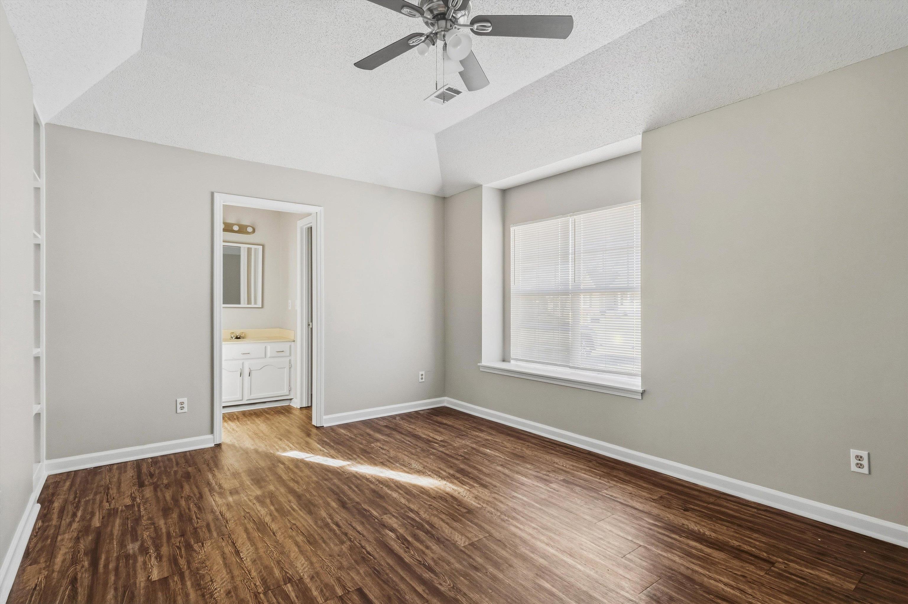6030 Chadwell Road Millington, TN 38053 - Photo 12 of 28 wooden floor in an empty room with a window