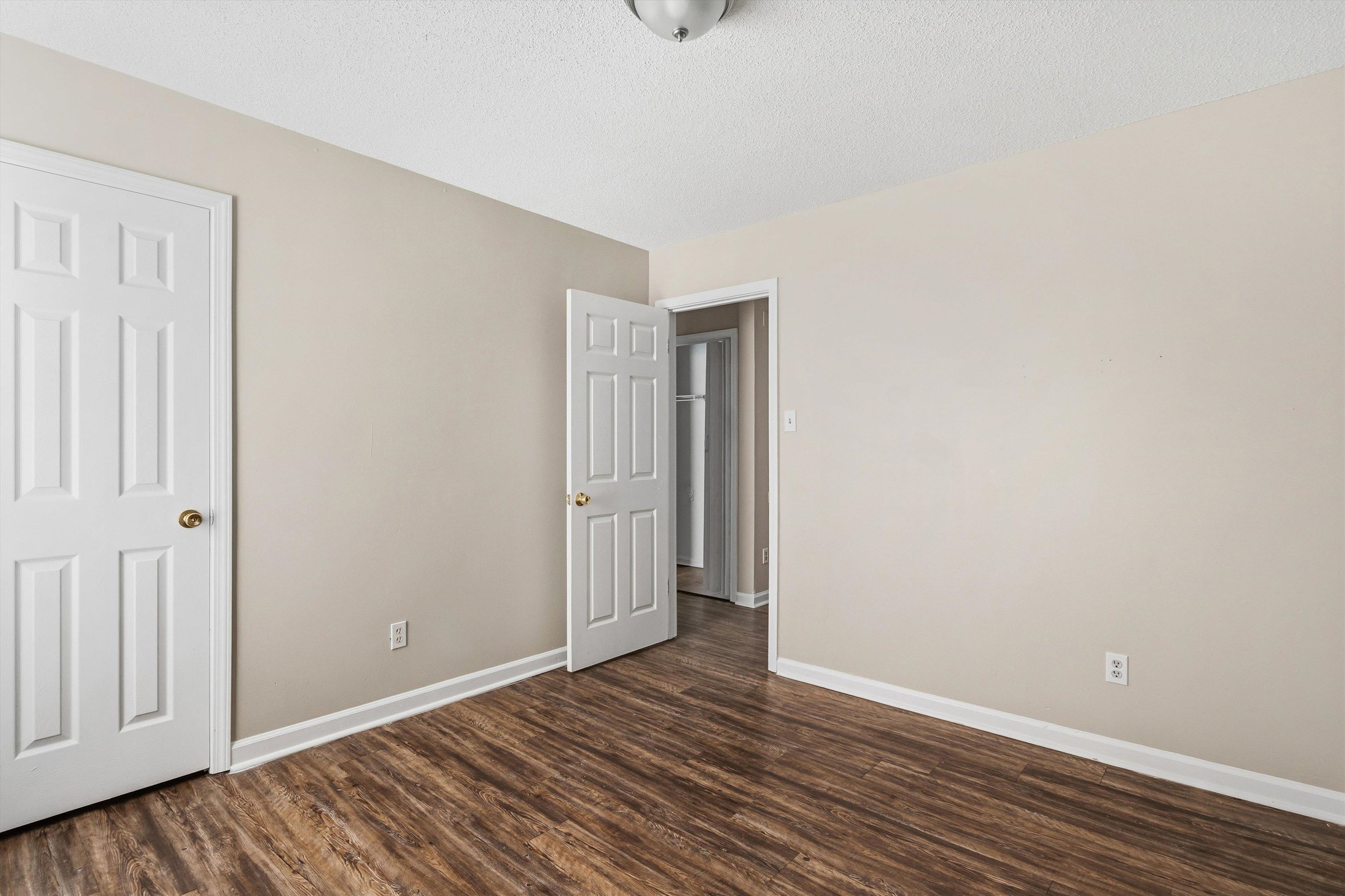 6030 Chadwell Road Millington, TN 38053 - Photo 18 of 28 a view of an empty room with wooden floor