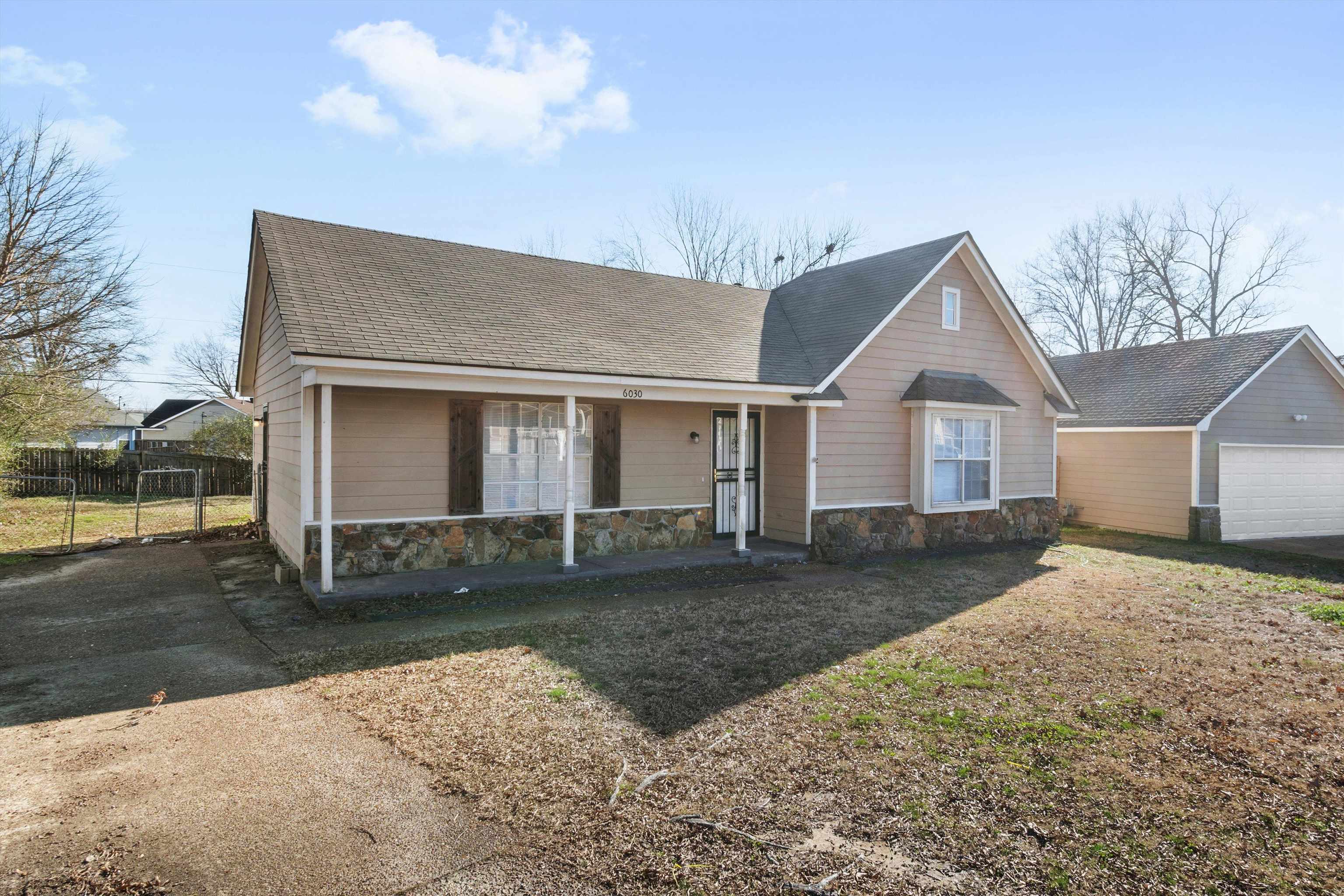 6030 Chadwell Road Millington, TN 38053 - Photo 2 of 28 a front view of a house with a yard and garage