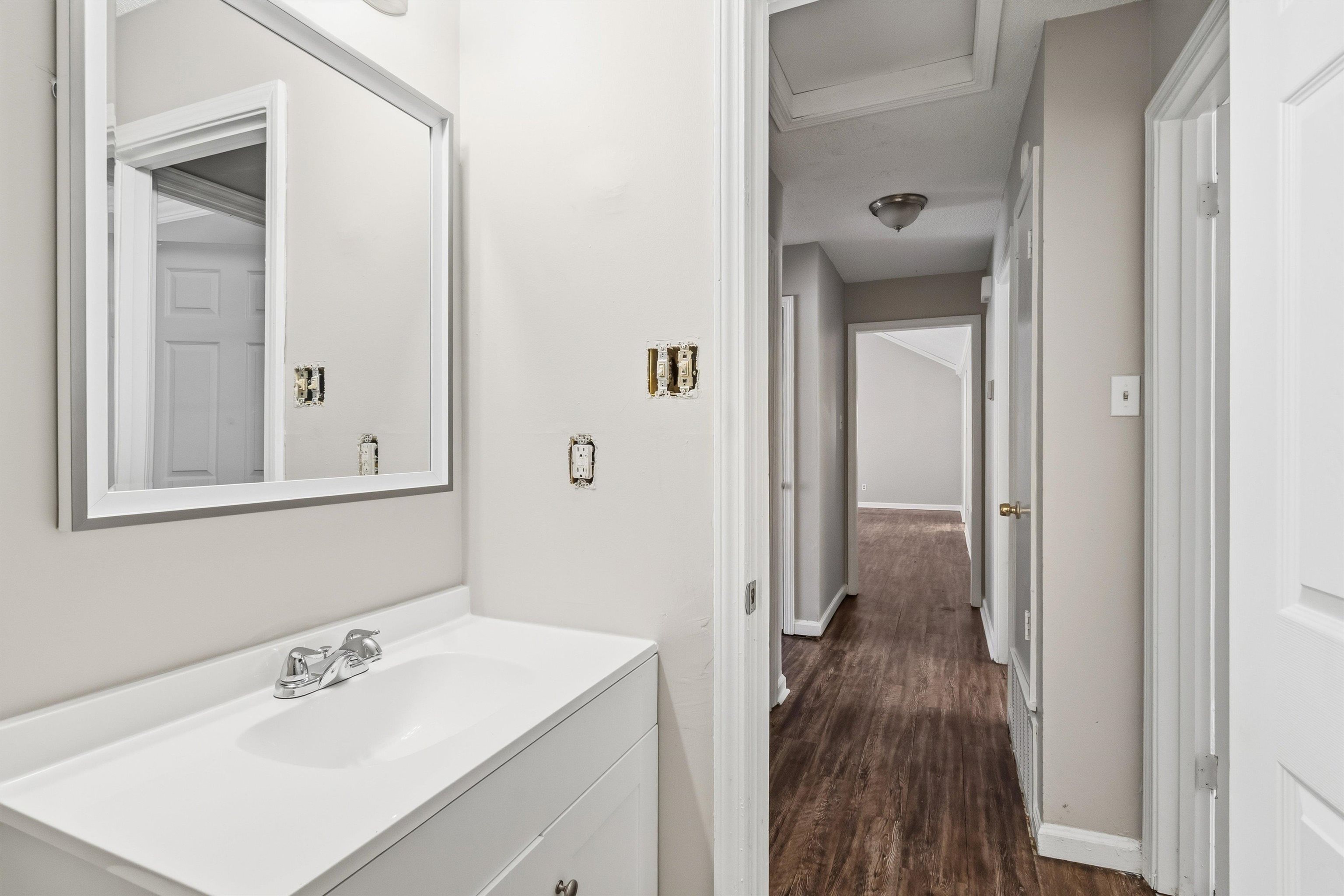 6030 Chadwell Road Millington, TN 38053 - Photo 21 of 28 a bathroom with a sink a mirror and a shower