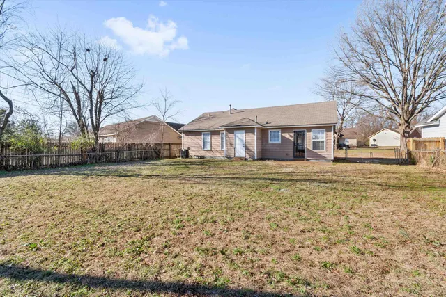 a house with trees in front of it