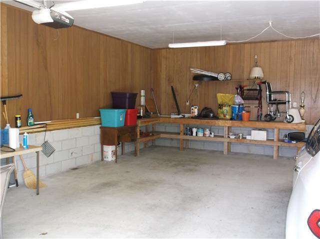 1854 Antioch Road Lafayette, TN 37083 - Photo 5 of 18 Inside of spacious garage, great for your vehicles, shop and all your toys.