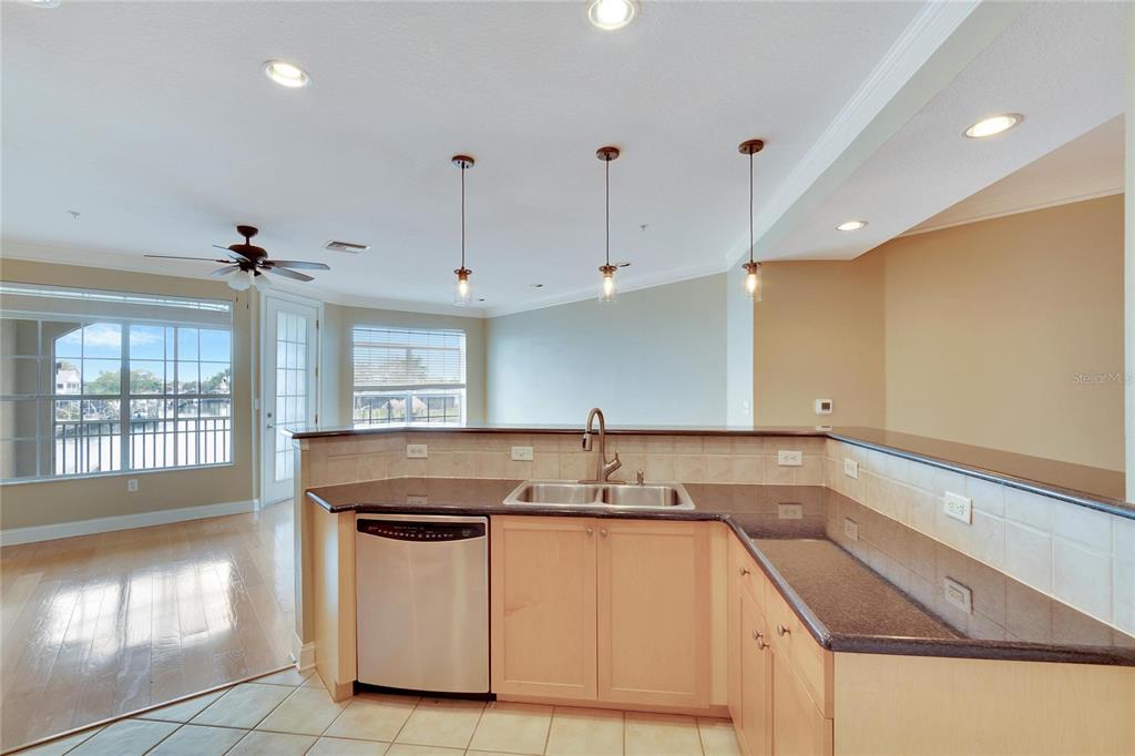 6414 Sunset Bay Circle Apollo Beach, FL 33572 - Photo 12 of 52 a kitchen that has a sink and a stove