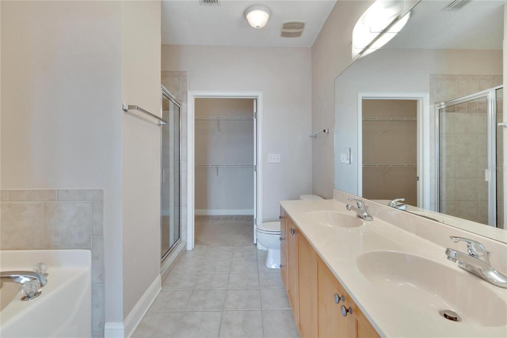 6414 Sunset Bay Circle Apollo Beach, FL 33572 - Photo 23 of 52 a bathroom with a sink and a mirror