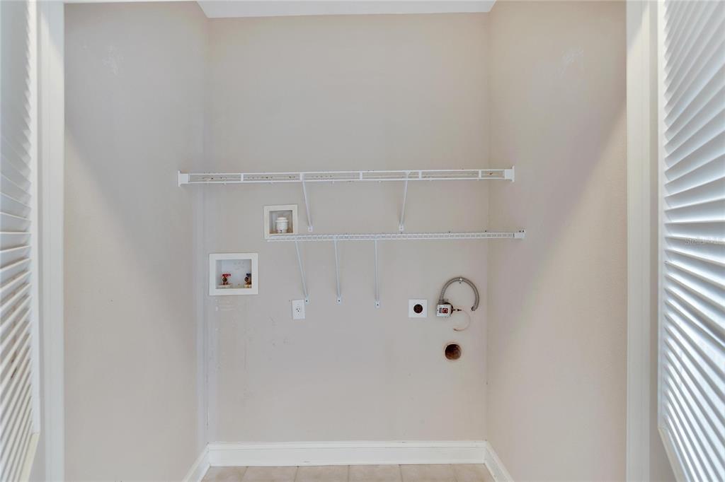 6414 Sunset Bay Circle Apollo Beach, FL 33572 - Photo 27 of 52 a bathroom with a bathtub
