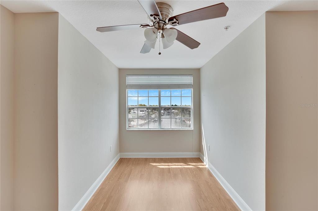 6414 Sunset Bay Circle Apollo Beach, FL 33572 - Photo 38 of 52 an empty room with a window and a ceiling fan