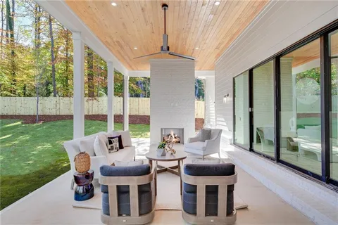 a dining room with furniture and a garden