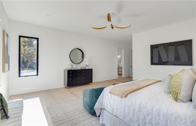 a bedroom with a bed and a dresser