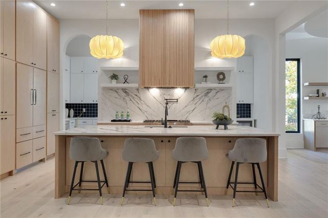 a view of kitchen island table and chairs