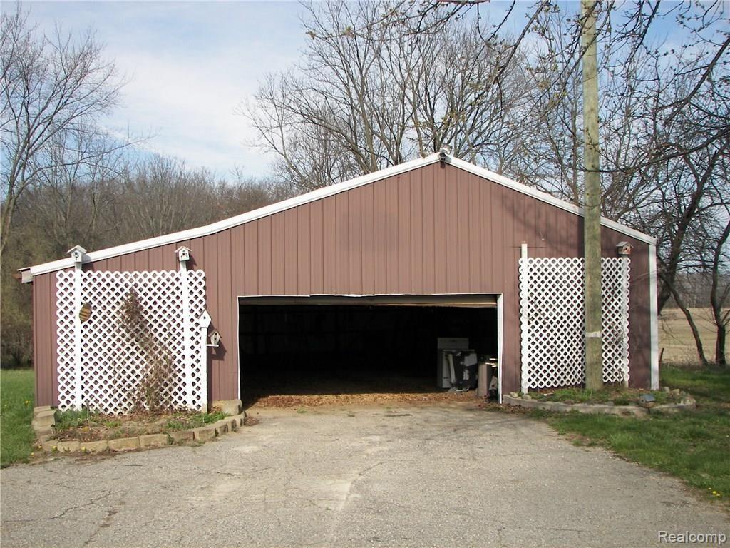 2756 Fisk Road Howell, MI 48843 - Photo 28 of 29 Barn which doubles as a garage. Lean to on the side for extra storage.