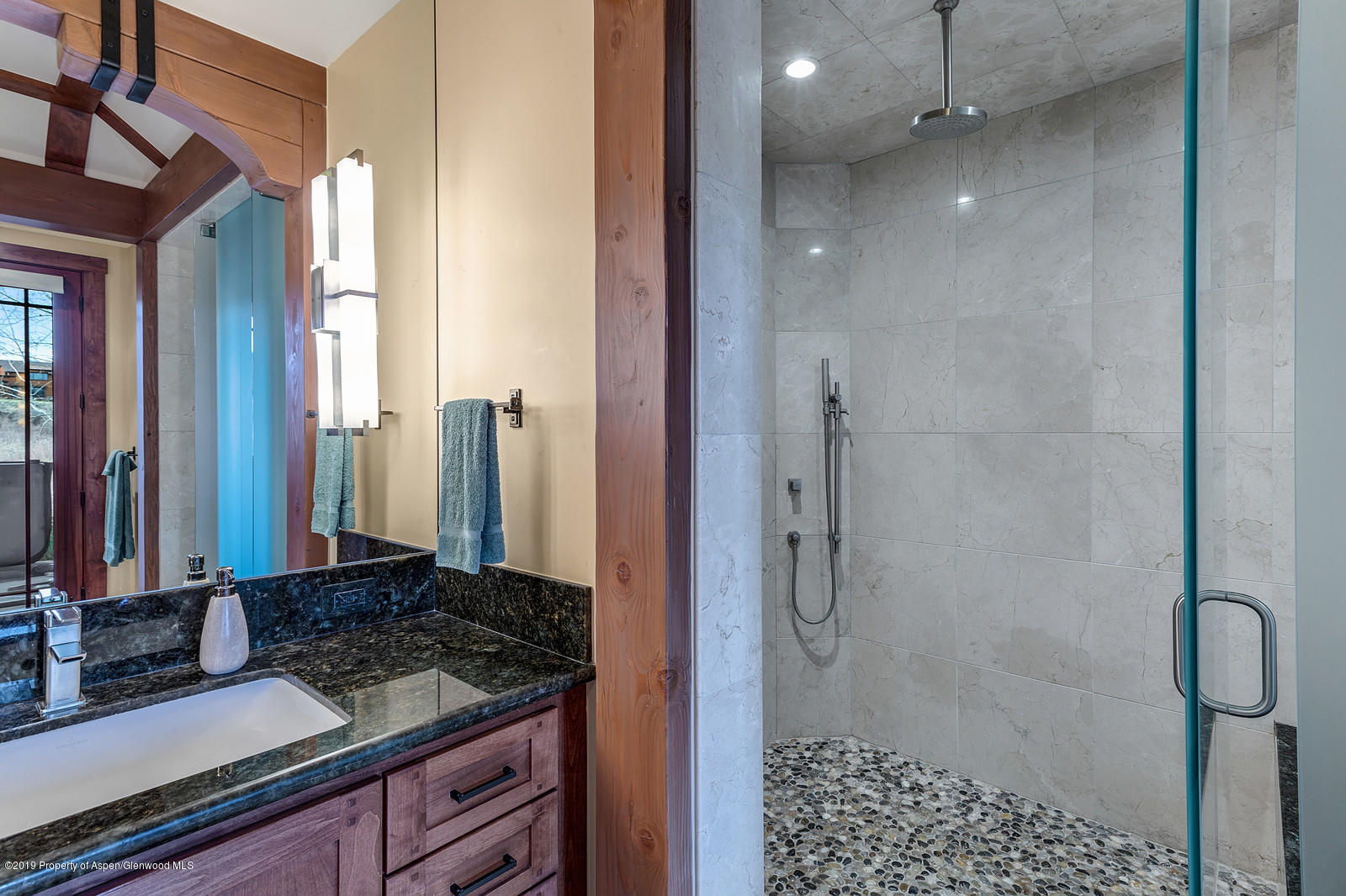 340 River's Bend Carbondale, CO 81623 - Photo 29 of 54 a bathroom with a granite countertop shower and a sink