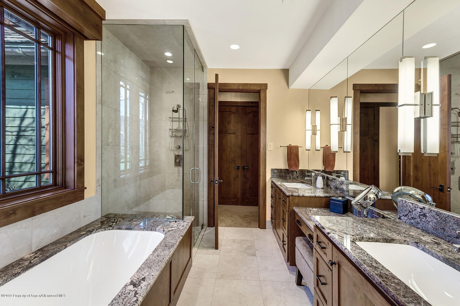 340 River's Bend Carbondale, CO 81623 - Photo 32 of 54 a bathroom with a granite countertop tub sink and mirror