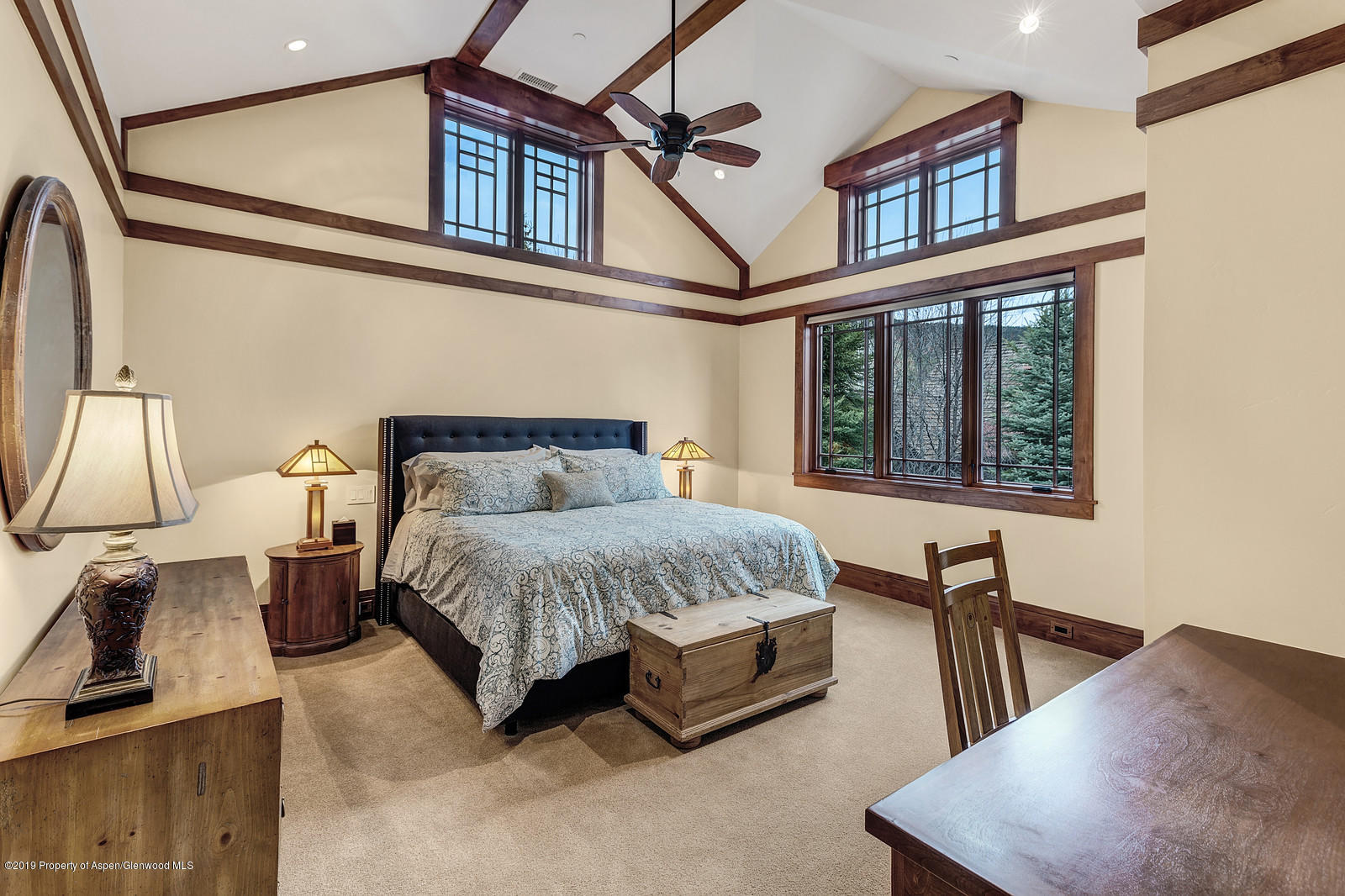 340 River's Bend Carbondale, CO 81623 - Photo 36 of 54 a bedroom with a bed a mirror and a large window