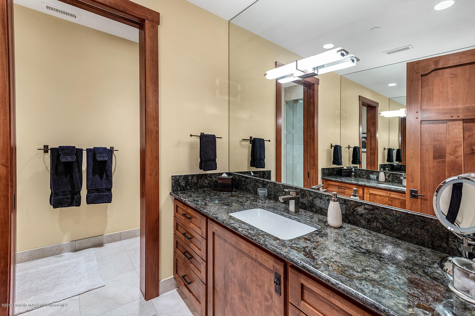 340 River's Bend Carbondale, CO 81623 - Photo 41 of 54 a bathroom with a granite countertop sink and a mirror