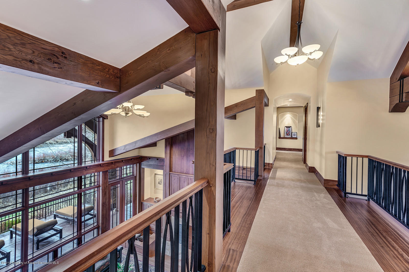 340 River's Bend Carbondale, CO 81623 - Photo 42 of 54 a view of a hallway with wooden floor and staircase
