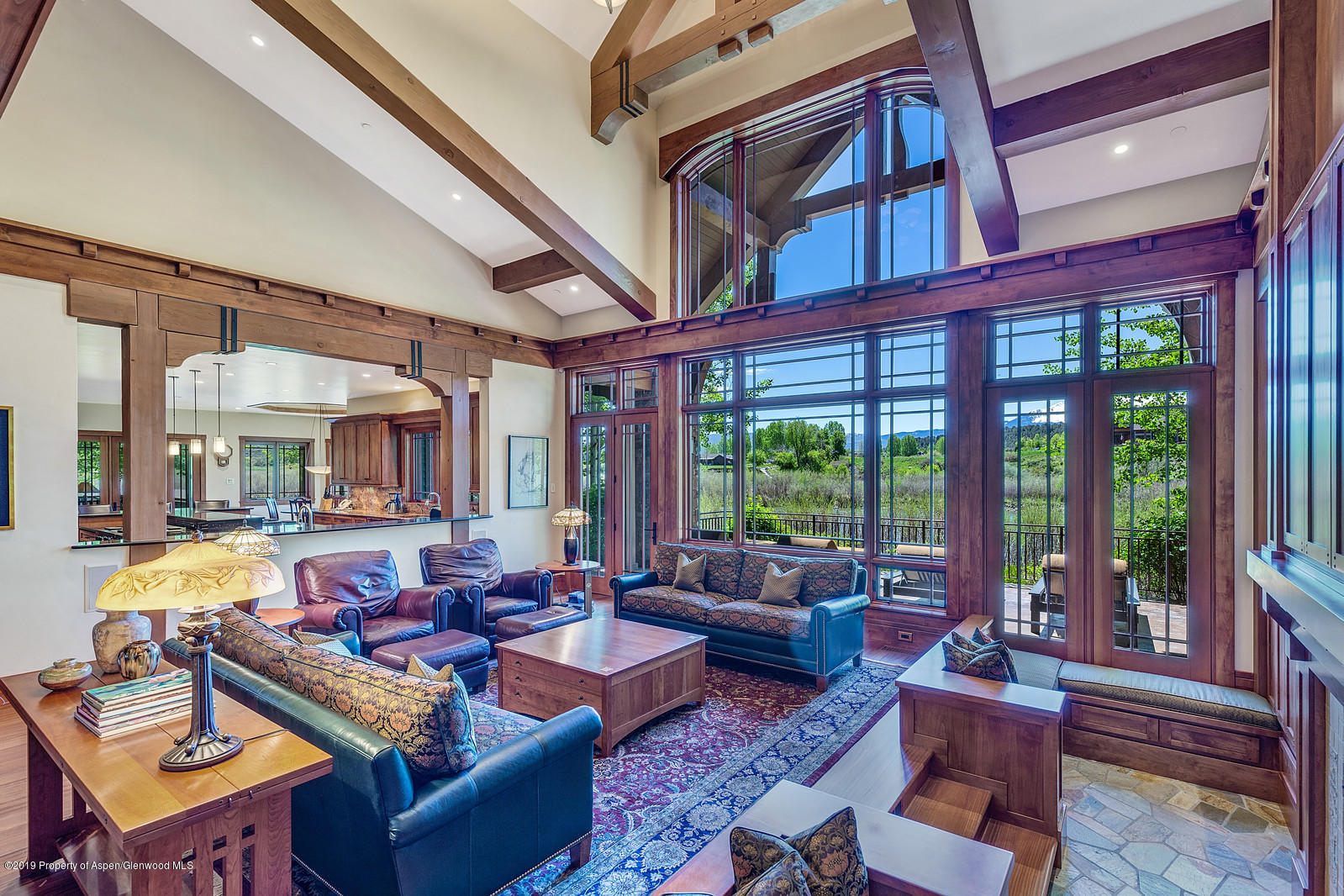 340 River's Bend Carbondale, CO 81623 - Photo 8 of 54 a living room with furniture and floor to ceiling windows