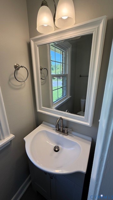 3817 Bridgeton Road Richmond, VA 23234 - Photo 19 of 23 a bathroom with a sink a mirror and a window