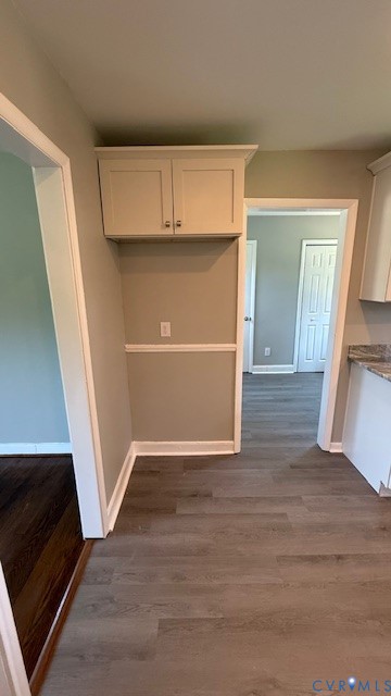 3817 Bridgeton Road Richmond, VA 23234 - Photo 7 of 23 a view of an empty room with wooden floor and a cabinet