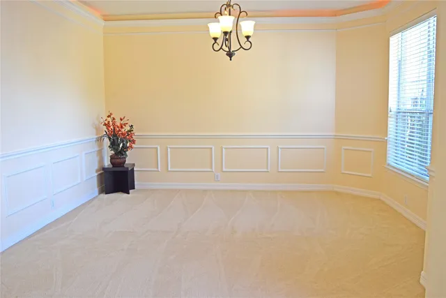 a view of a room with wooden floor and windows