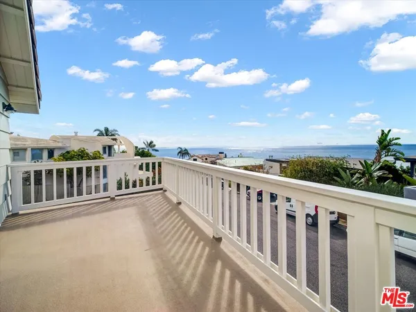 a view of a balcony with city view
