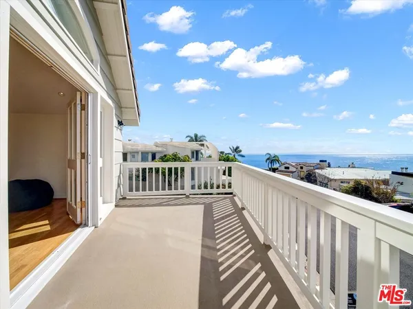 a view of a balcony with city view