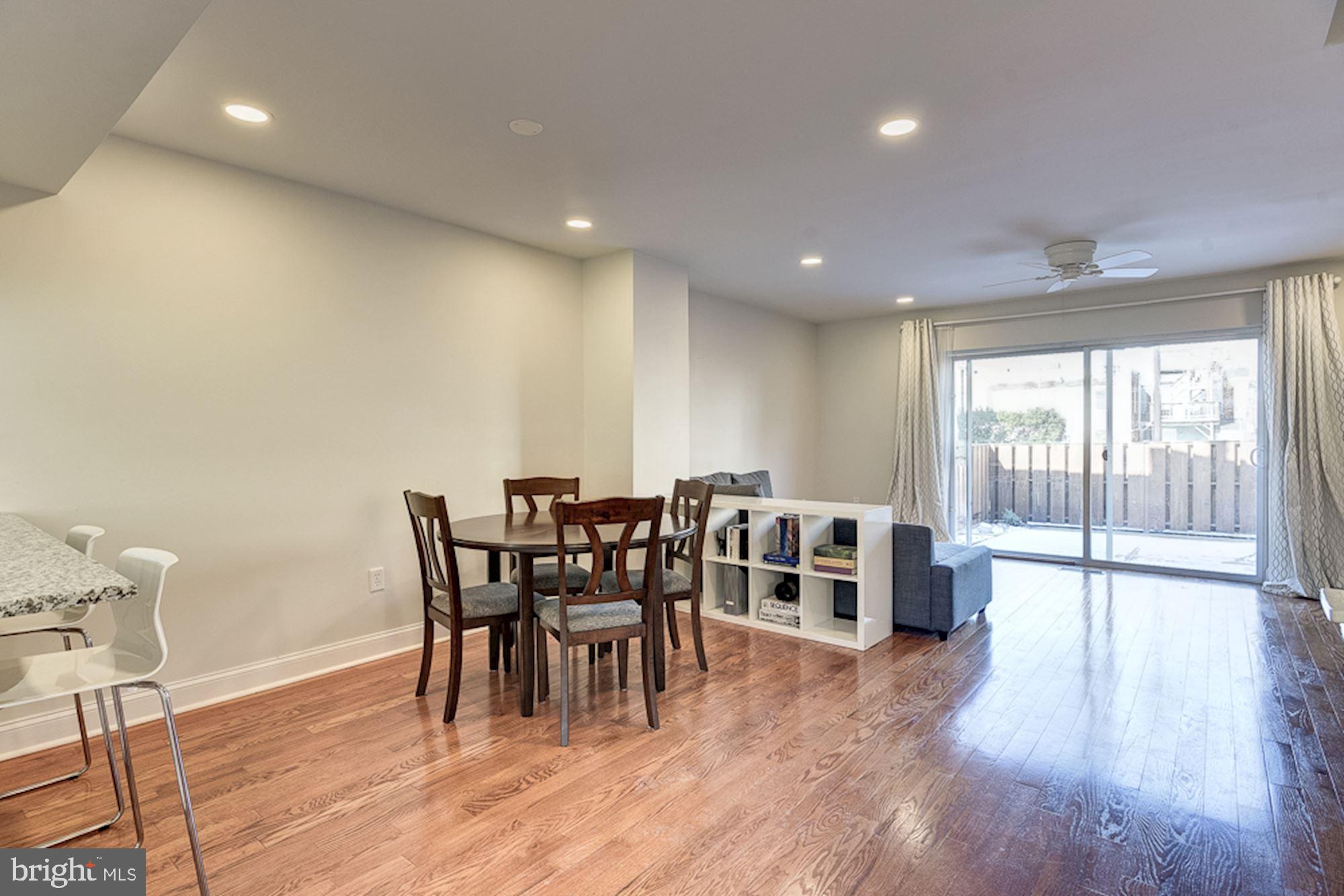 2806 Elliott Street Baltimore, MD 21224 - Photo 9 of 40 Dining Room | Living Room | Hardwood Floors