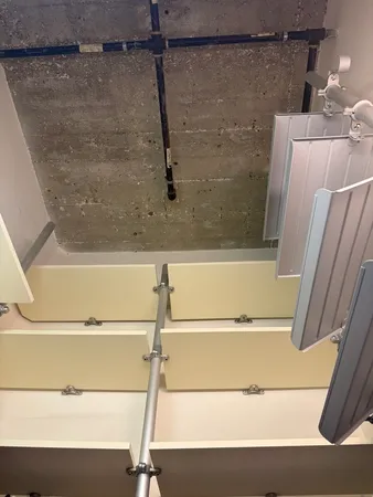 a bathroom with a shower and a sink