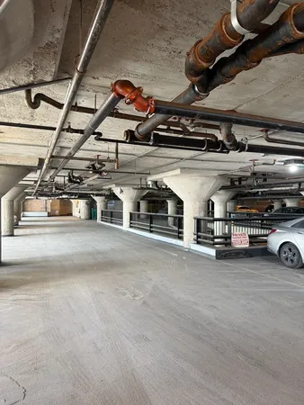 a view of a kitchen with stainless steel appliances
