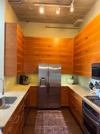 a bathroom with a sink and a large mirror