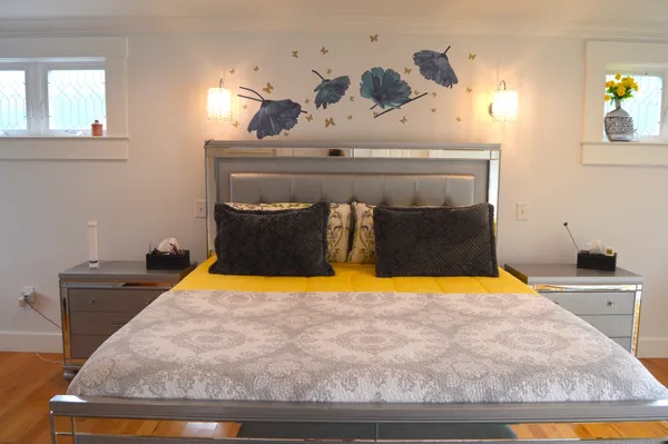 a bedroom with a bed and lamps