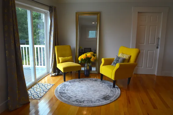 a living room with furniture and a table