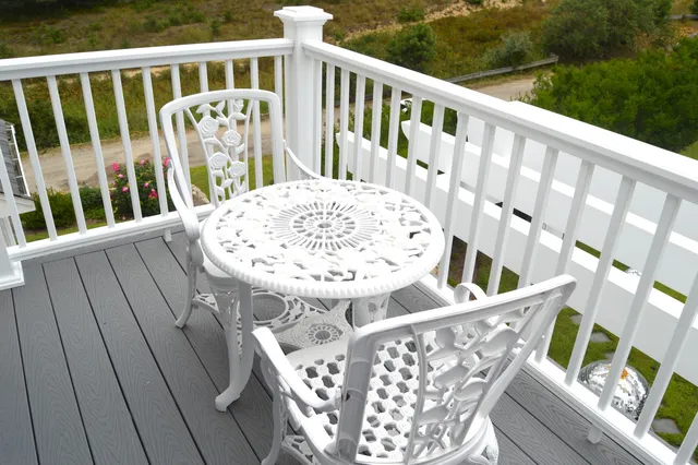 a view of balcony with wooden floor