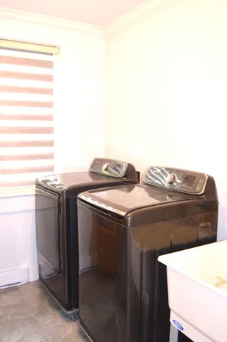 a utility room with washer and dryer