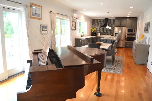 an open kitchen with dining table and chairs