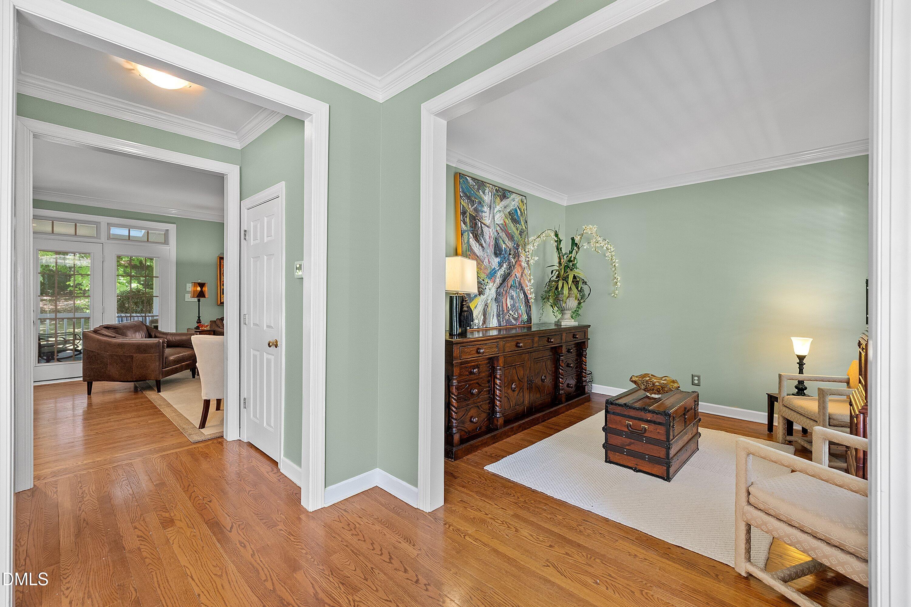 3914 Sterling Ridge Lane Durham, NC 27707 - Photo 10 of 66 Hardwood flooring throughout, wide archways, and crown molding