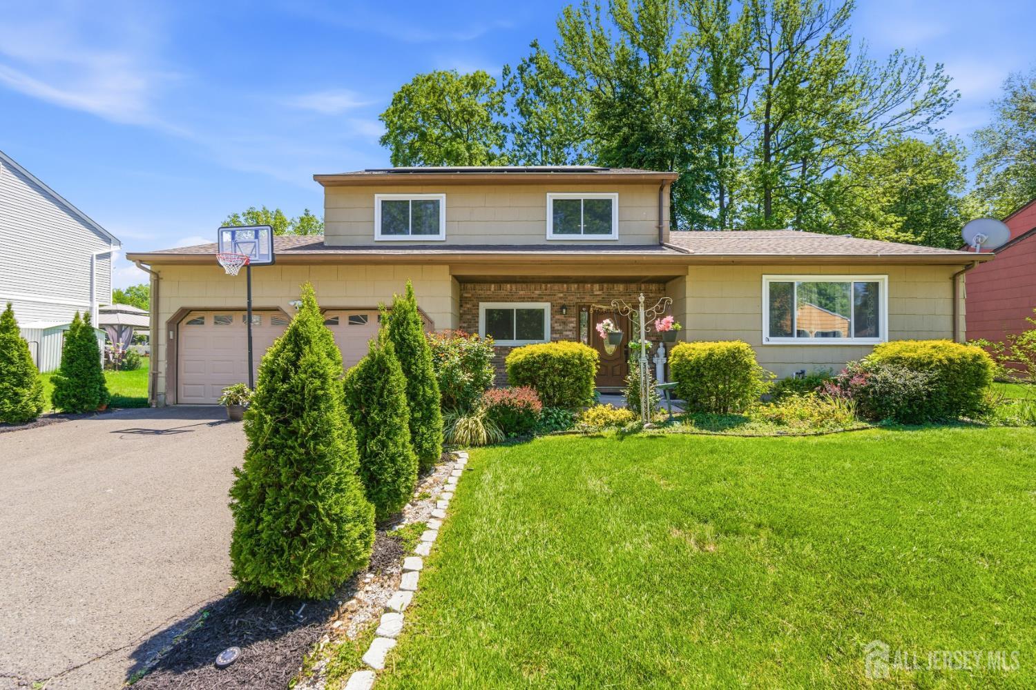 213 Normandy Road Edison, NJ 08820 - Photo 4 of 45 front view of a house with a yard