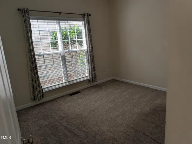 a view of a room that has a window in it