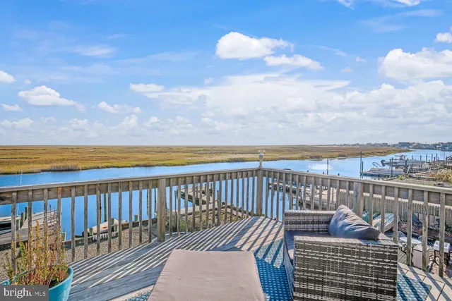 a roof deck with outdoor seating