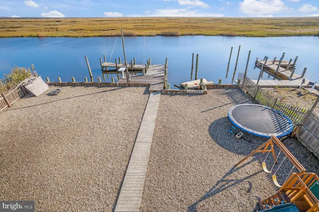a balcony with wooden floor and city view