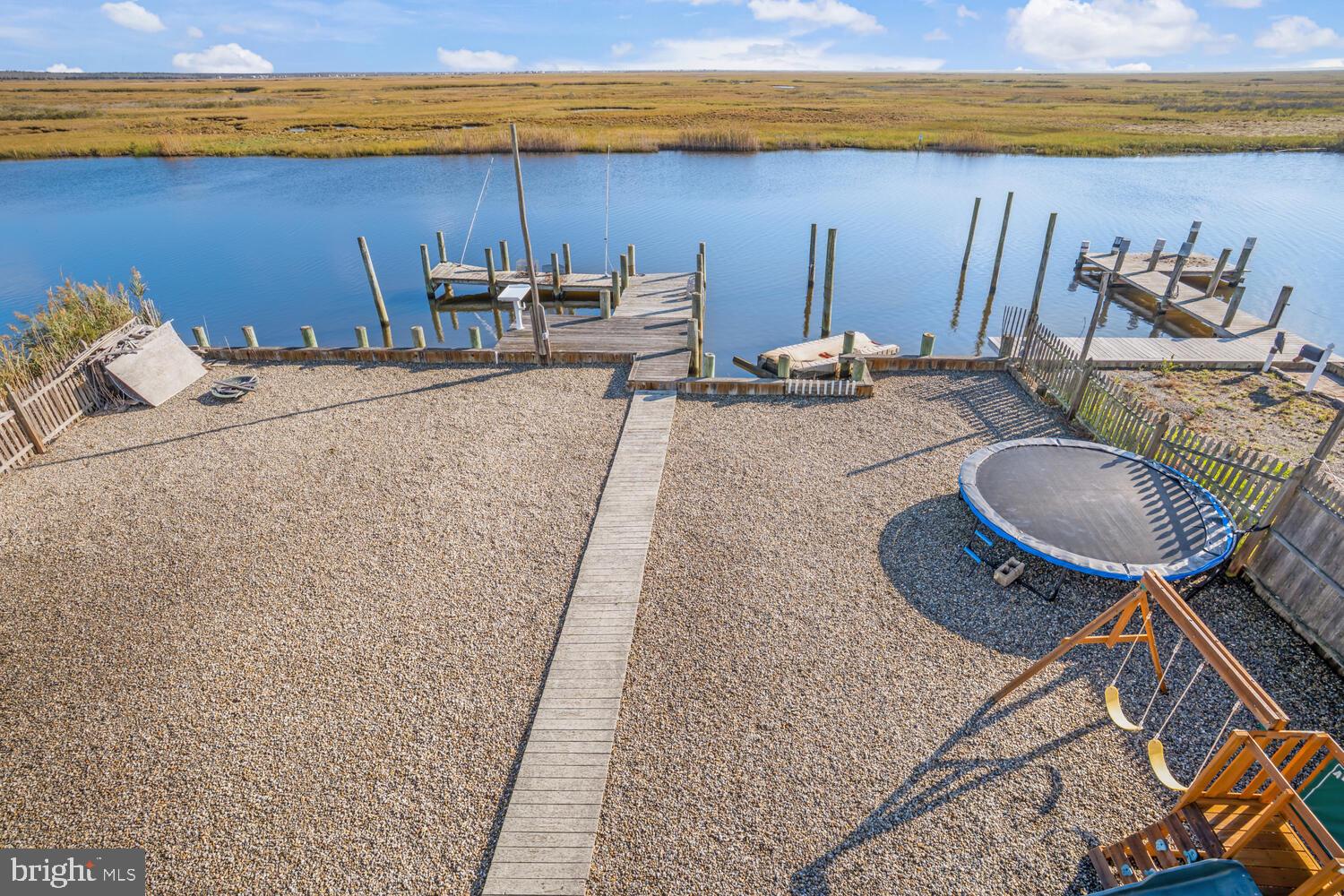 322 Dock Road West Creek, NJ 08092 - Photo 14 of 49 a backyard of a house with table and chairs