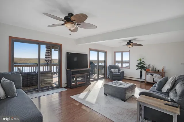 a view of a dining room with furniture and a chandelier