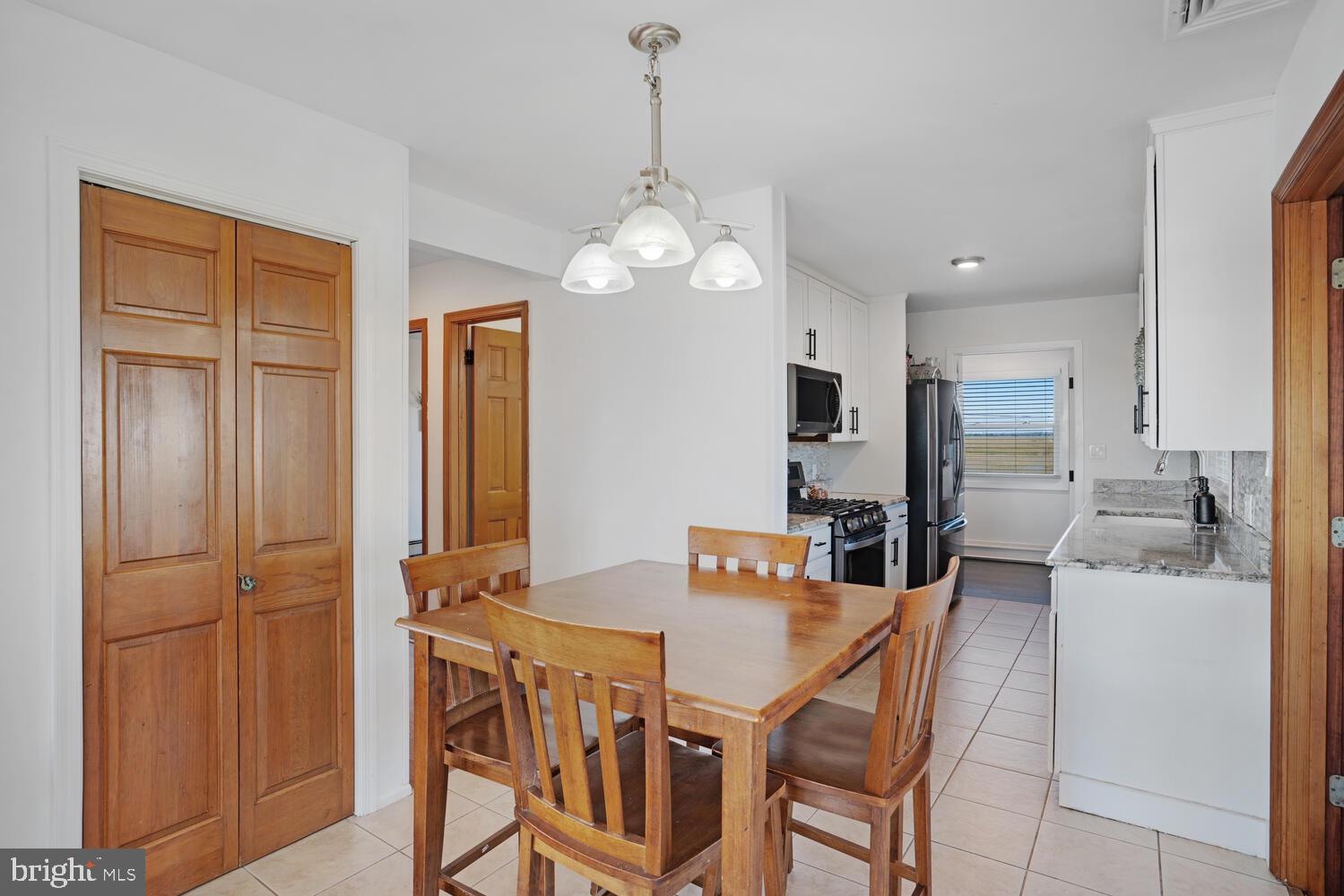 322 Dock Road West Creek, NJ 08092 - Photo 27 of 49 a view of a dining room with furniture and a chandelier