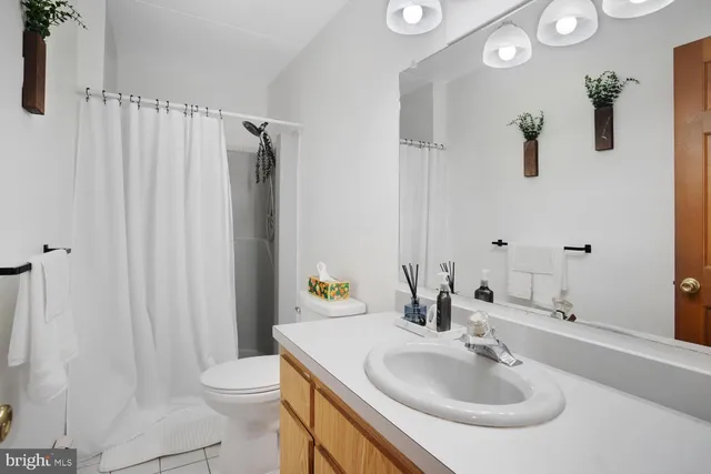 a bedroom with a bed and a television